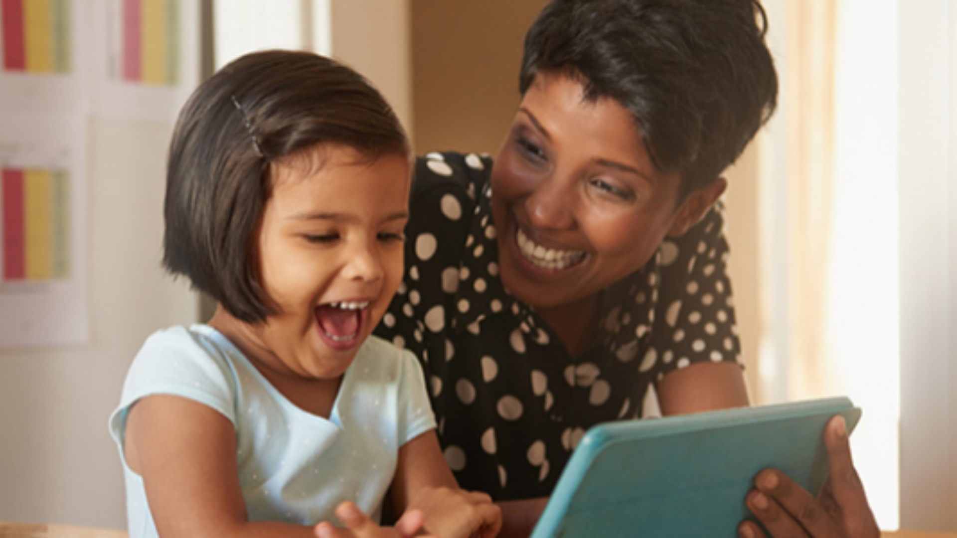 Mother and daughter viewing an iPad