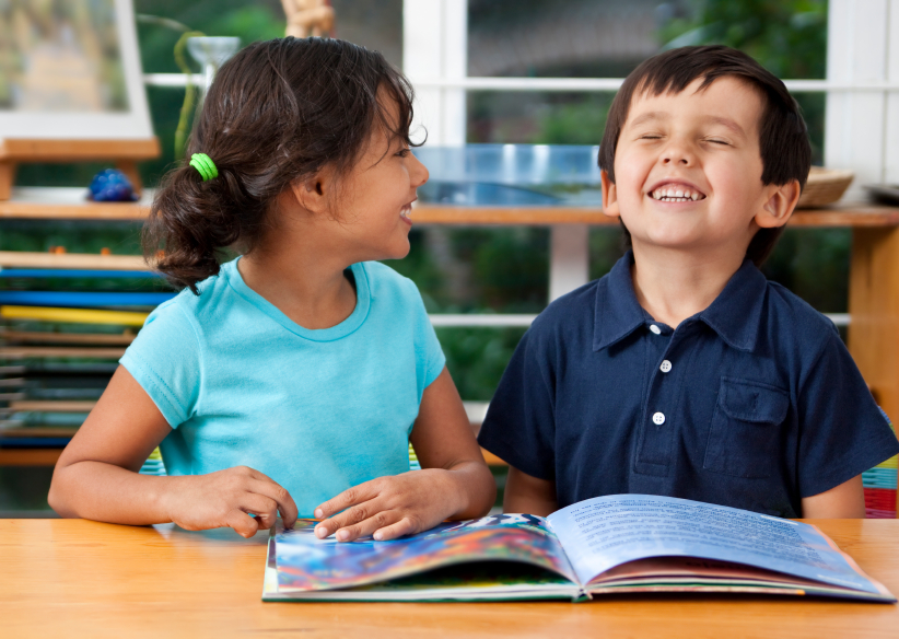 Two kids laughing together