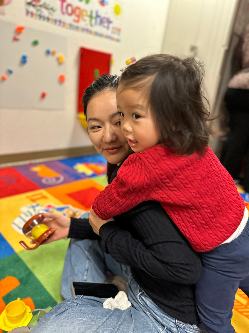 Child Hugging Adult